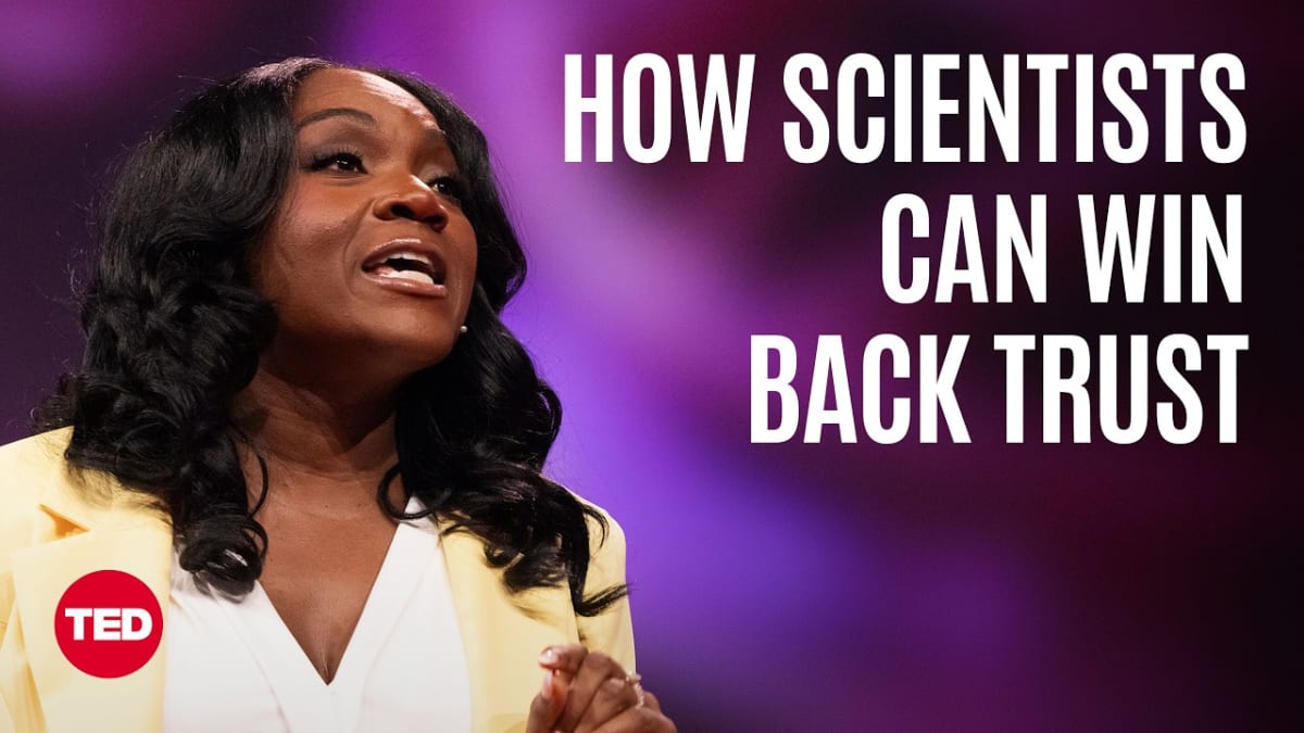 ** Dr. Kizzmekia Corbett speaking on TED stage about vaccine trust and science communication