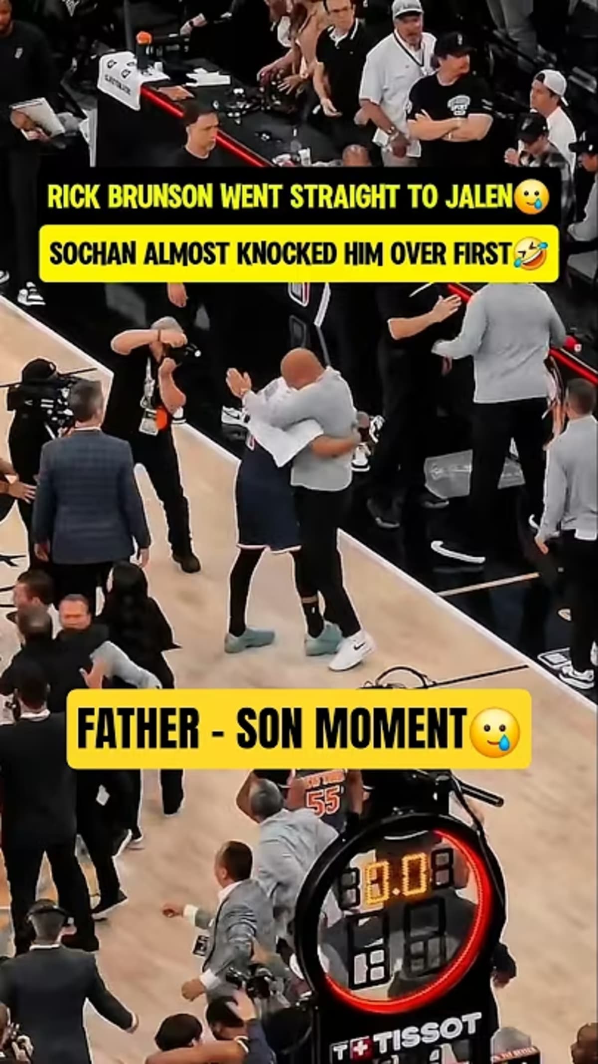 ** Assistant coach Rick Brunson embracing his son Jalen after New York Knicks NBA championship victory