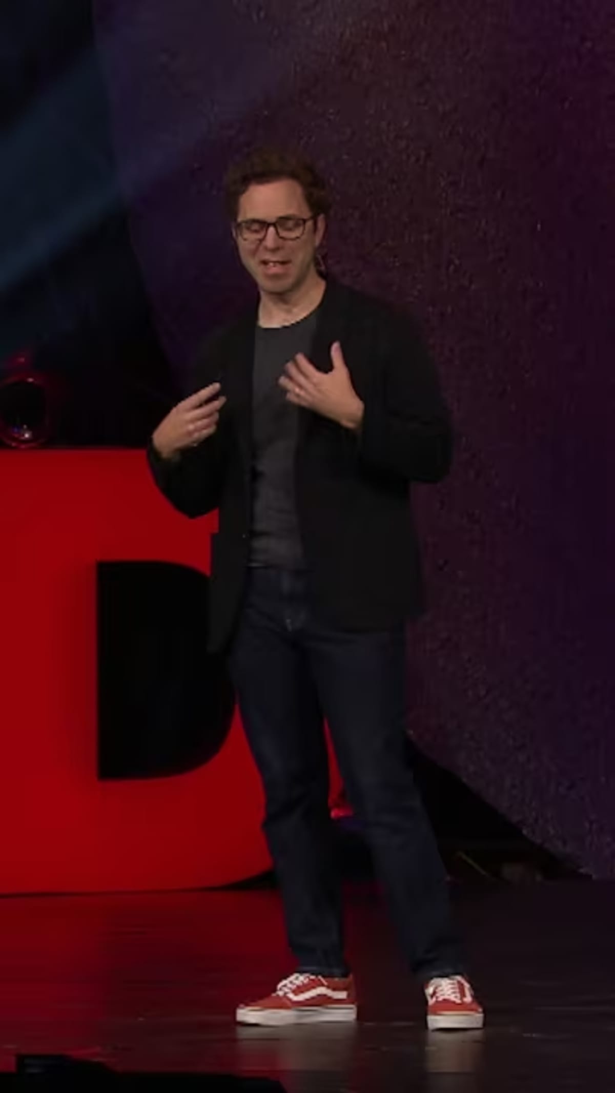 Speaker presenting TED talk about aphantasia and the inability to visualize mental images