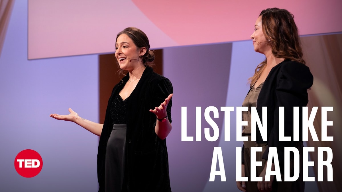** Two women presenting together on TED stage about communication and listening skills