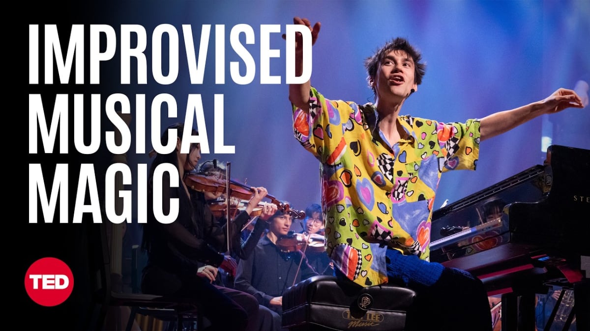 ** Jacob Collier conducting young orchestra musicians on TED stage during live improvised performance