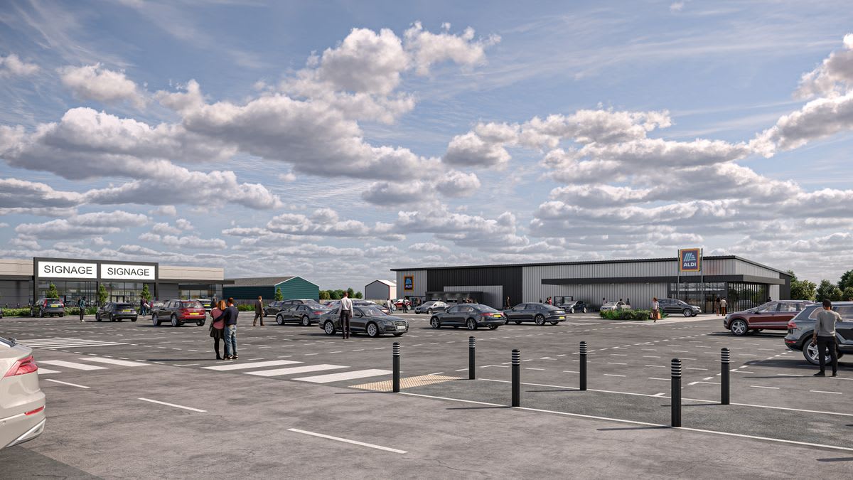Computer-generated rendering showing modern Aldi supermarket storefront with parking lot in Northumberland
