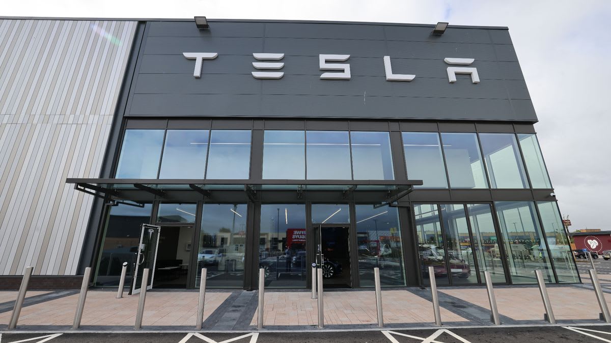 White Tesla Model 3 electric vehicle representing the company's UK sales milestone