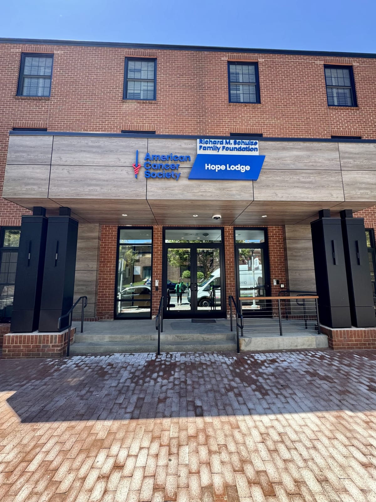 Modern Hope Lodge Baltimore building exterior with welcoming entrance and windows on urban campus
