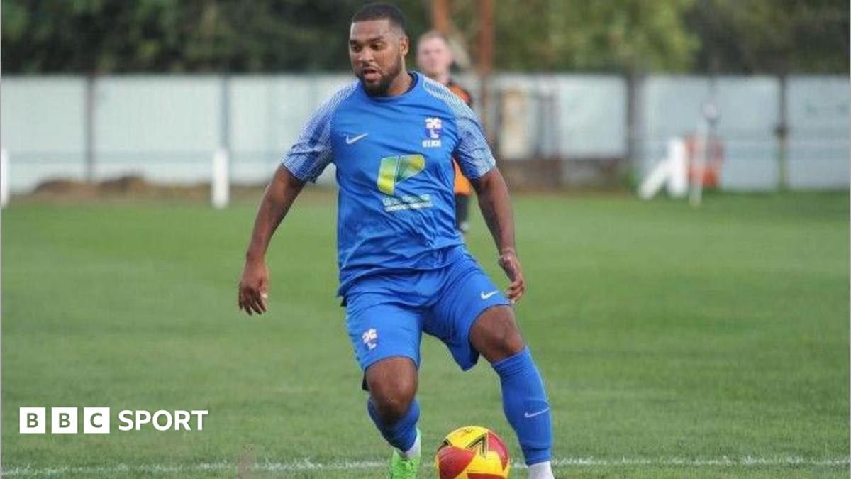 Zeph Thomas standing on football pitch at Dearne and District's ground in South Yorkshire