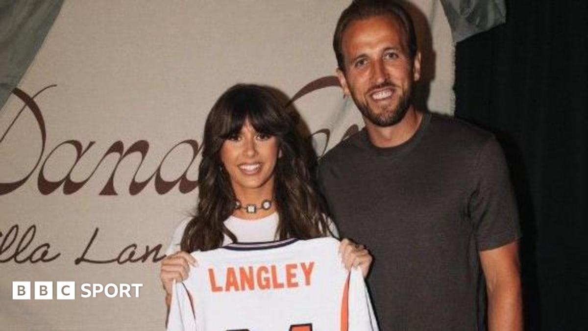England captain Harry Kane standing beside country music singer Ella Langley holding England jersey