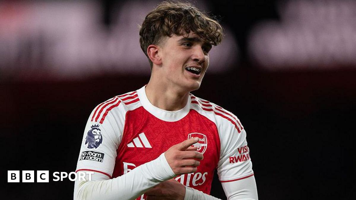 Young Arsenal midfielder Max Dowman on the football pitch in red kit during match