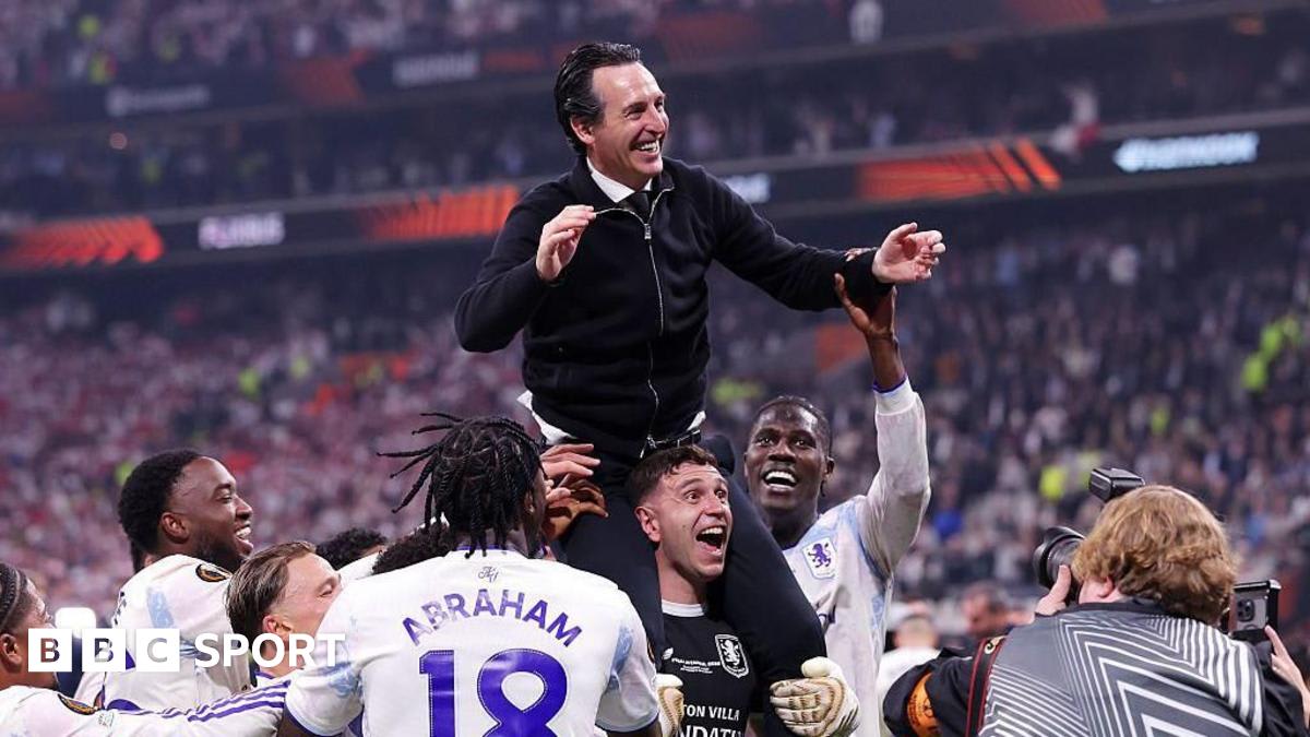 Aston Villa players celebrate with Europa League trophy after defeating Freiburg in Istanbul