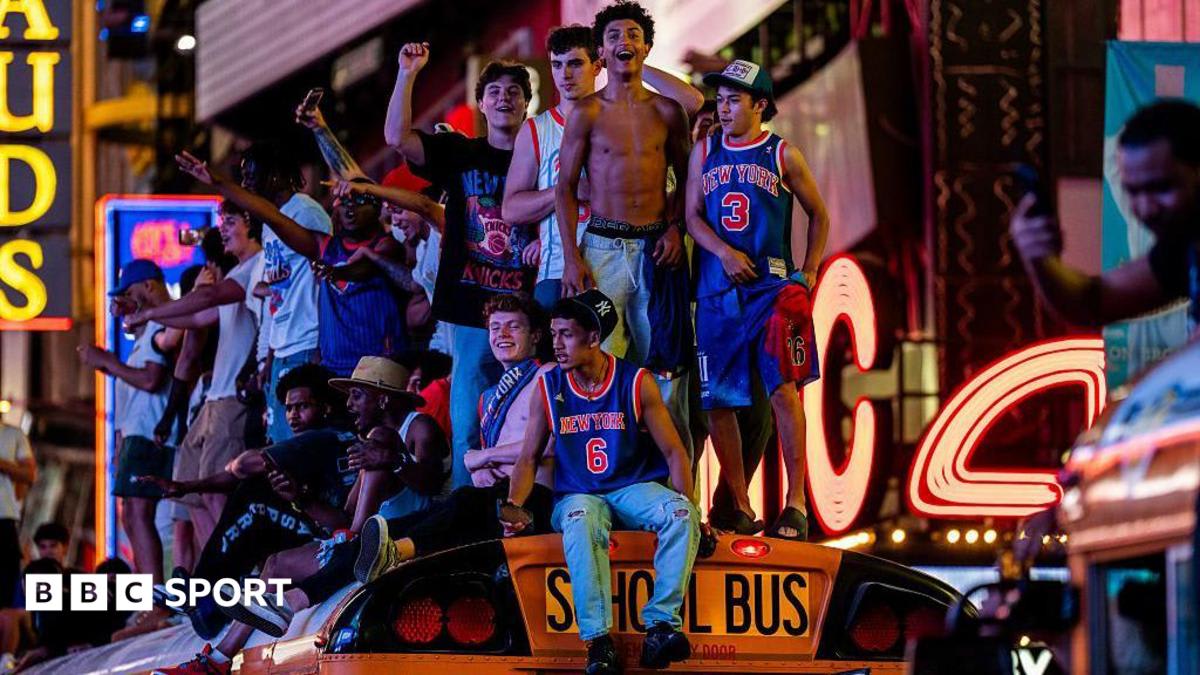 Crowds of New York Knicks fans celebrating outside Madison Square Garden after championship victory