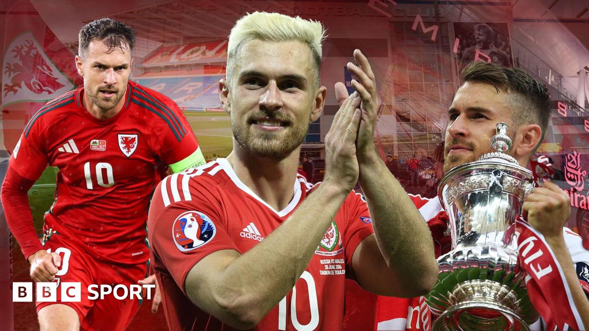 ** Aaron Ramsey in Wales national team red jersey celebrating during Euro 2016 tournament