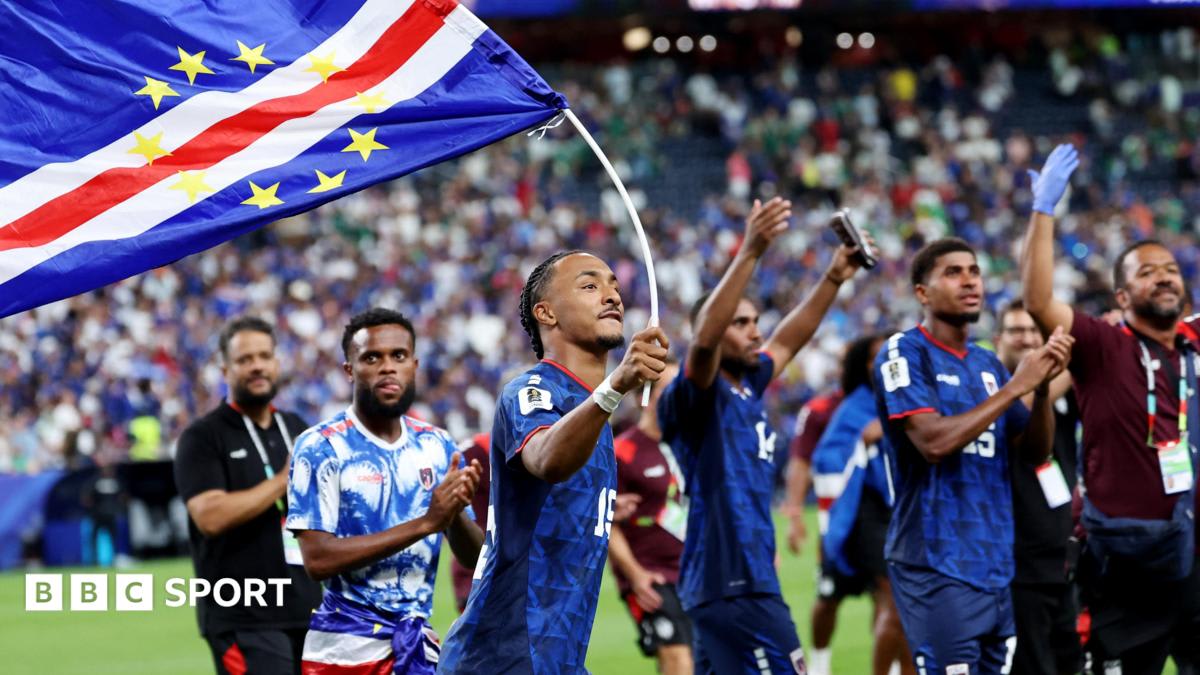 Cape Verde football players celebrating together on the pitch after making World Cup history