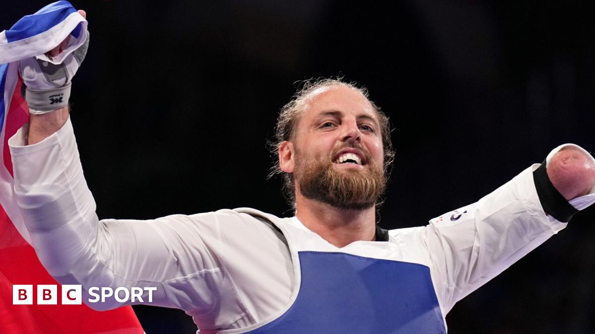 Matt Bush celebrating his European Championship gold medal victory in taekwondo competition