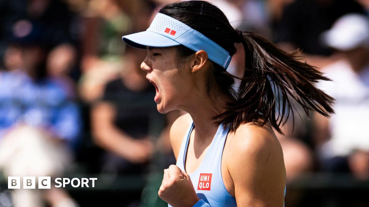 Emma Raducanu smiling and waving to crowd after winning her Indian Wells tennis match