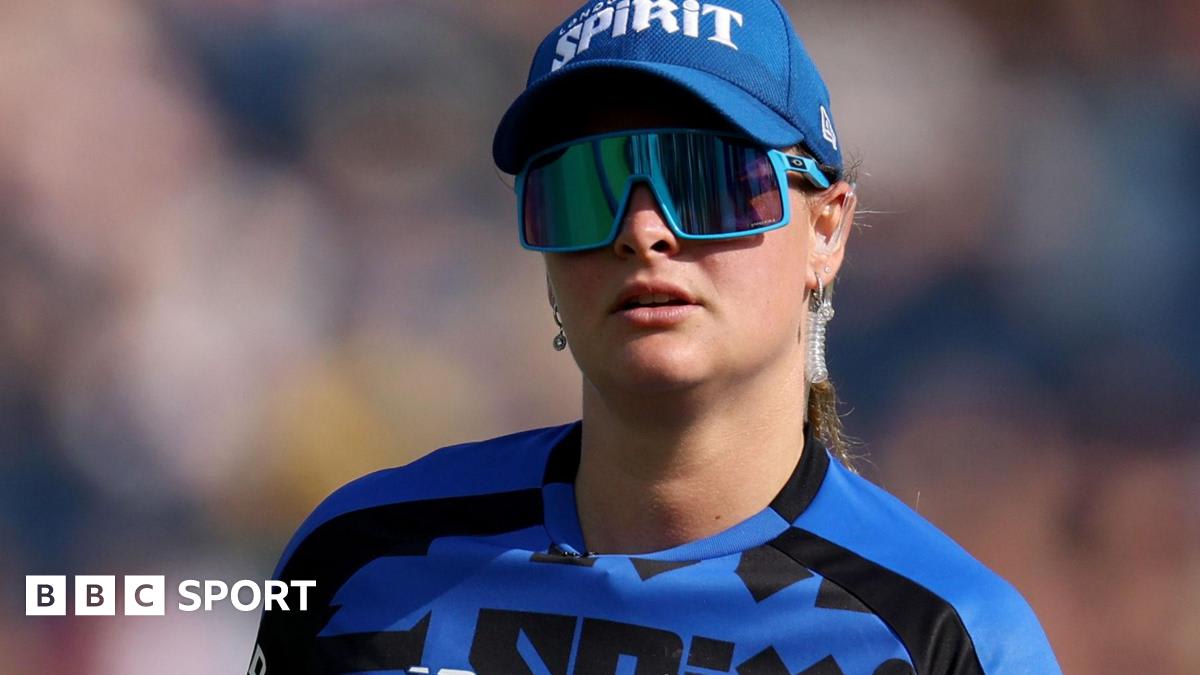 Young female cricketer Danielle Gibson celebrating in England uniform on cricket field