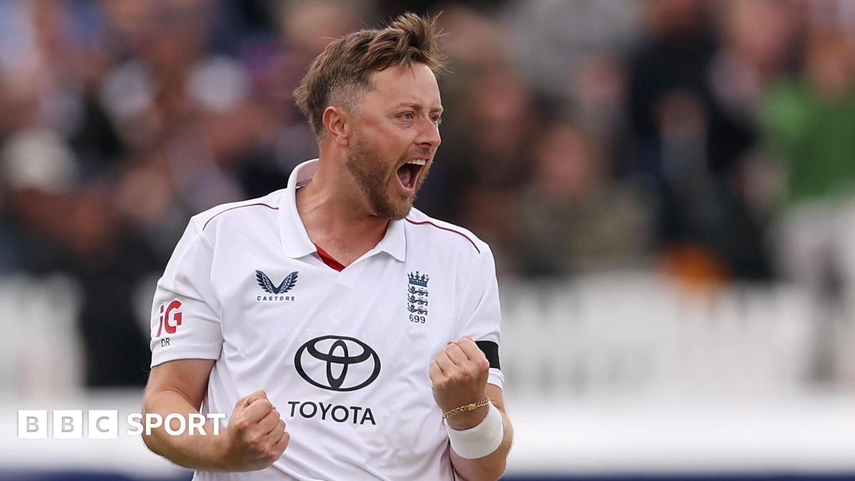 ** Cricket bowler Ollie Robinson celebrating with raised arms at Lord's Cricket Ground in London