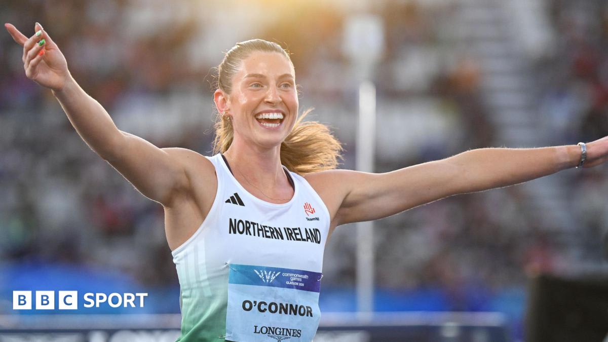 Kate O'Connor celebrates with Northern Ireland flag after winning Commonwealth Games heptathlon gold medal