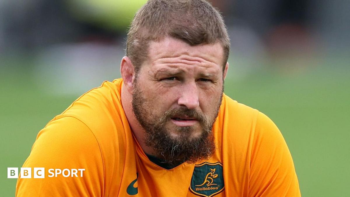 James Slipper walking through guard of honor formed by New Zealand All Blacks players