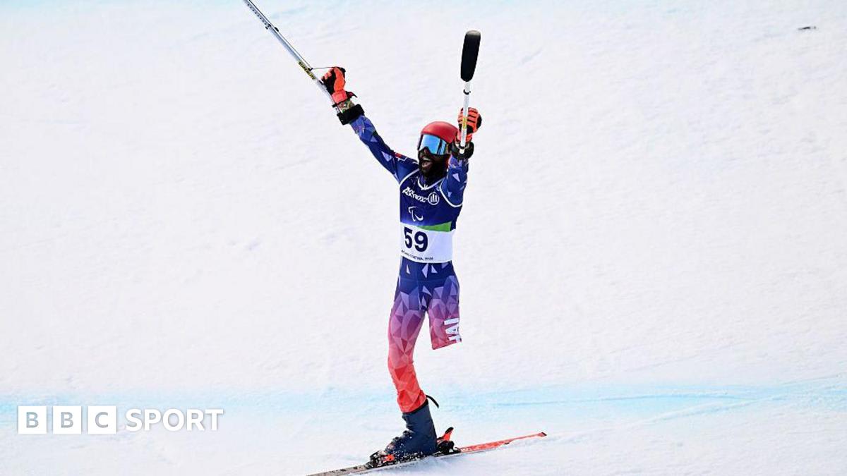 Ralf Etienne celebrates at Winter Paralympics wearing Haiti's red and blue colors