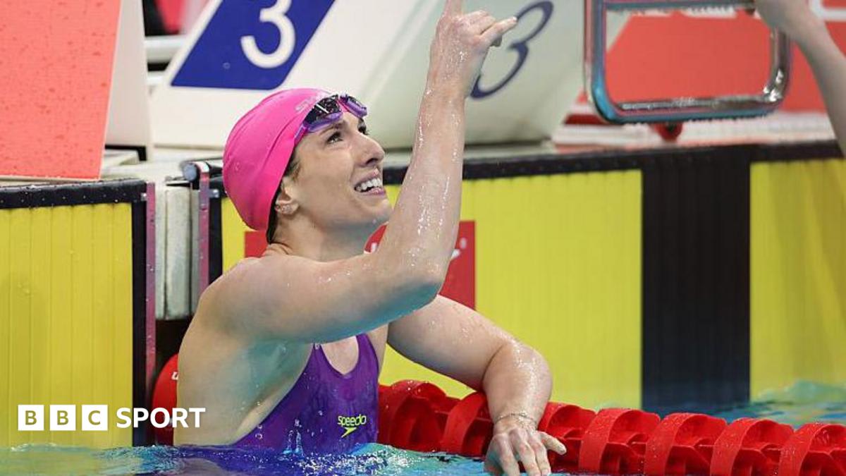 Bethany Firth celebrating in pool after breaking her own world record in backstroke