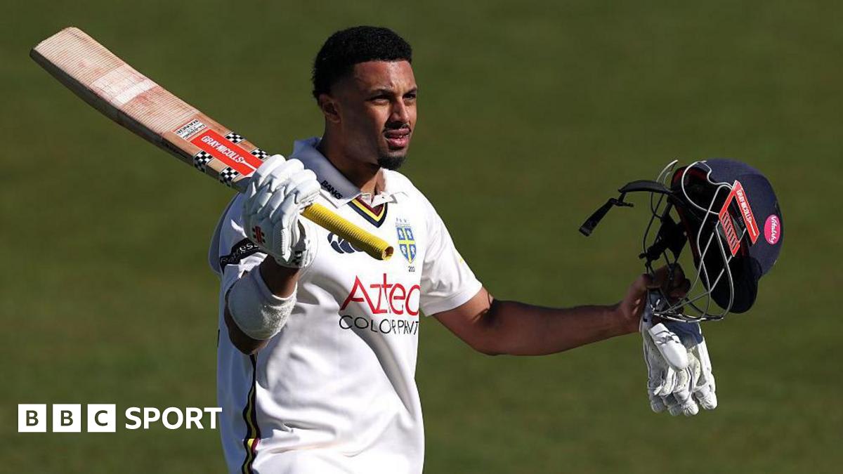 Cricket player Emilio Gay in Durham uniform celebrating after scoring a century