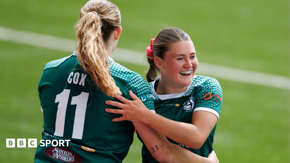 Isla Norman-Bell celebrating with Trailfinders teammates after scoring try against Gloucester-Hartpury