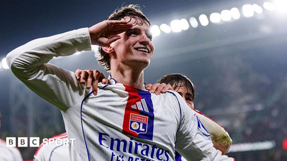 Tyler Morton in Lyon jersey controlling the ball during a Ligue 1 match