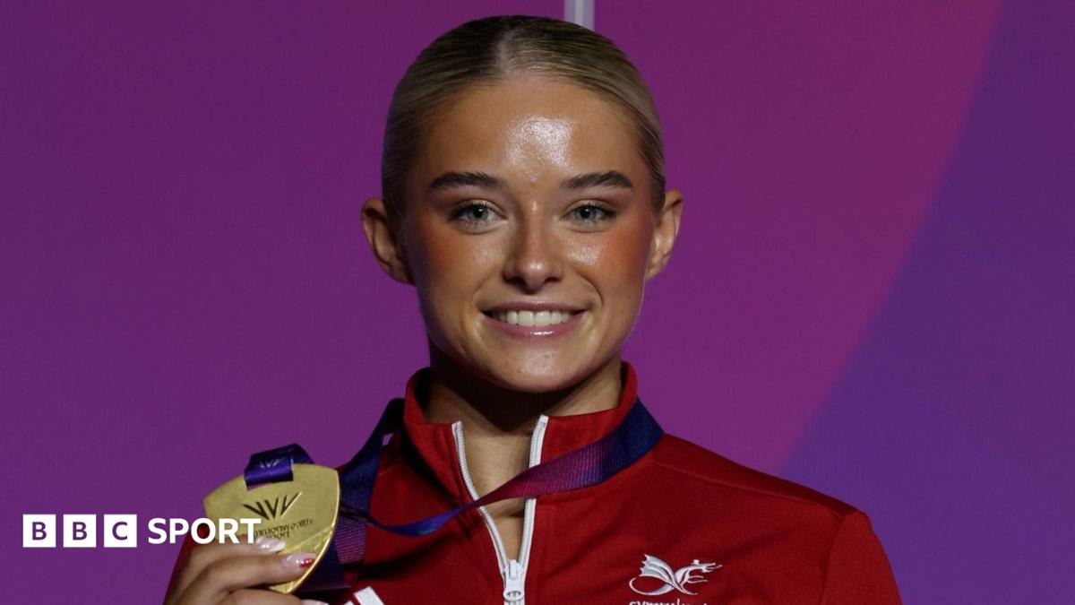 Ruby Evans in sparkling gold gymnastics costume performing floor routine at Commonwealth Games