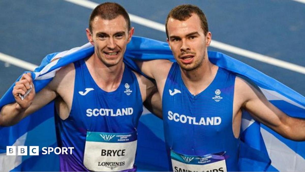 Ben Sandilands and Steven Bryce celebrating their Commonwealth Games medals on the podium in Glasgow