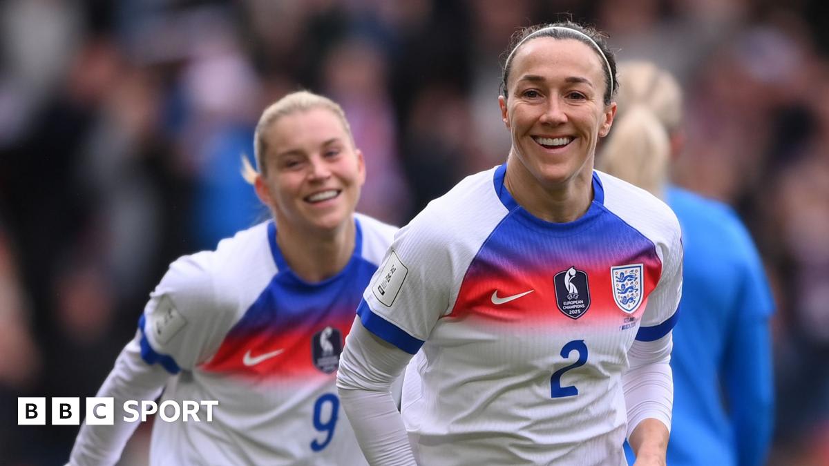 Lucy Bronze in white England jersey celebrating after scoring header against Iceland