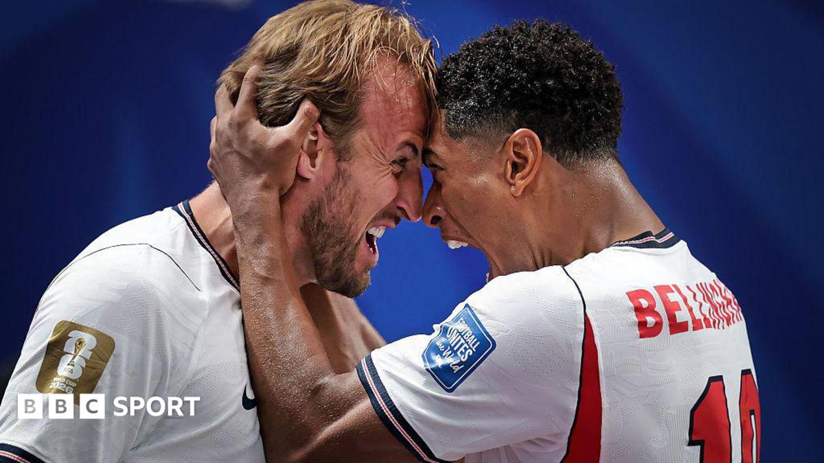 Harry Kane celebrating with England teammates after scoring dramatic late World Cup goal