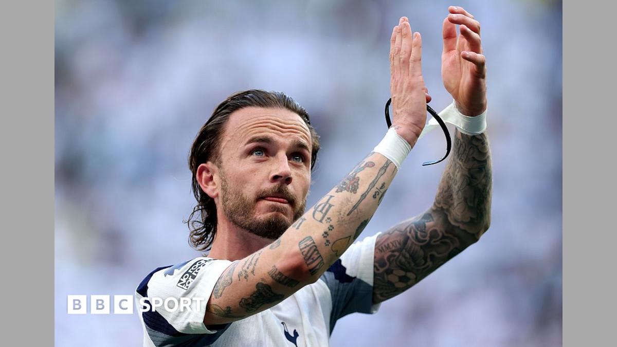 Tottenham midfielder James Maddison training on the pitch in white Spurs jersey