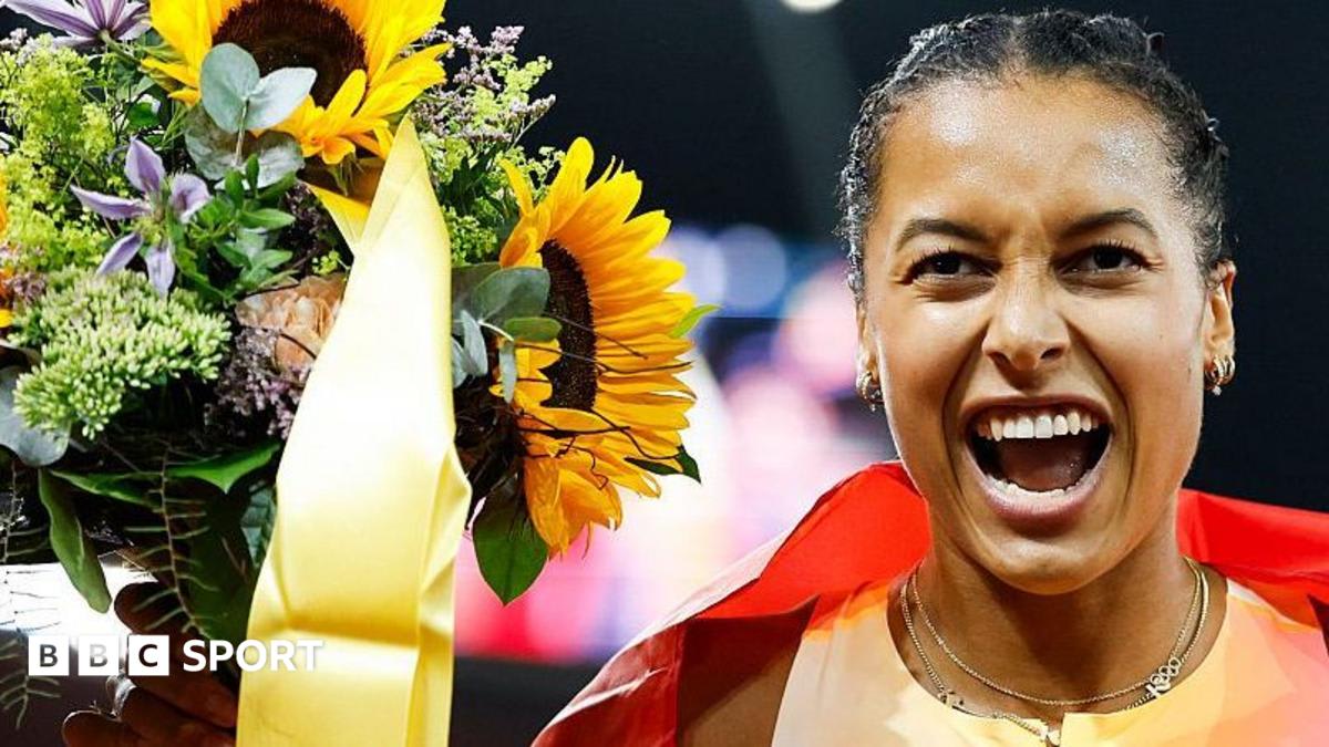 Audrey Werro racing on track in Zurich stadium with capacity crowd watching