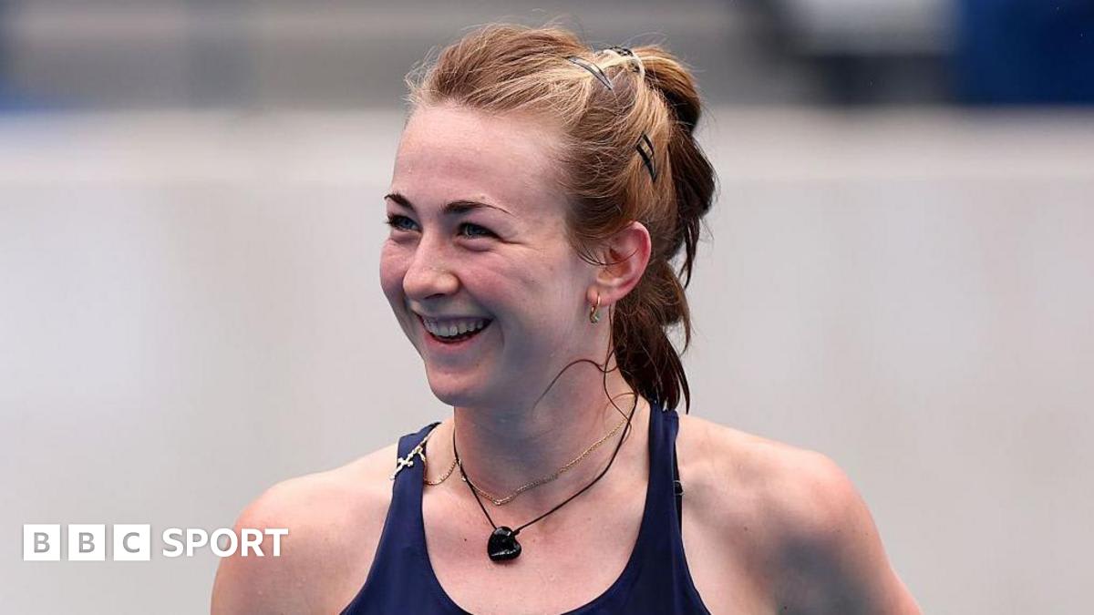 Teen tennis player Mika Stojsavljevic holding trophy after winning 2024 US Open junior championship