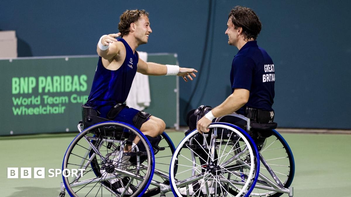 Alfie Hewett and Gordon Reid celebrating with World Team Cup trophy alongside captain and teammate