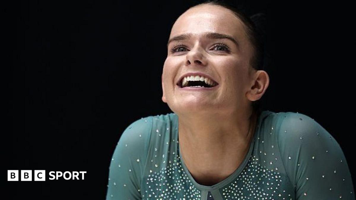 Olympic gymnast Alice Kinsella in British Team GB leotard performing on balance beam