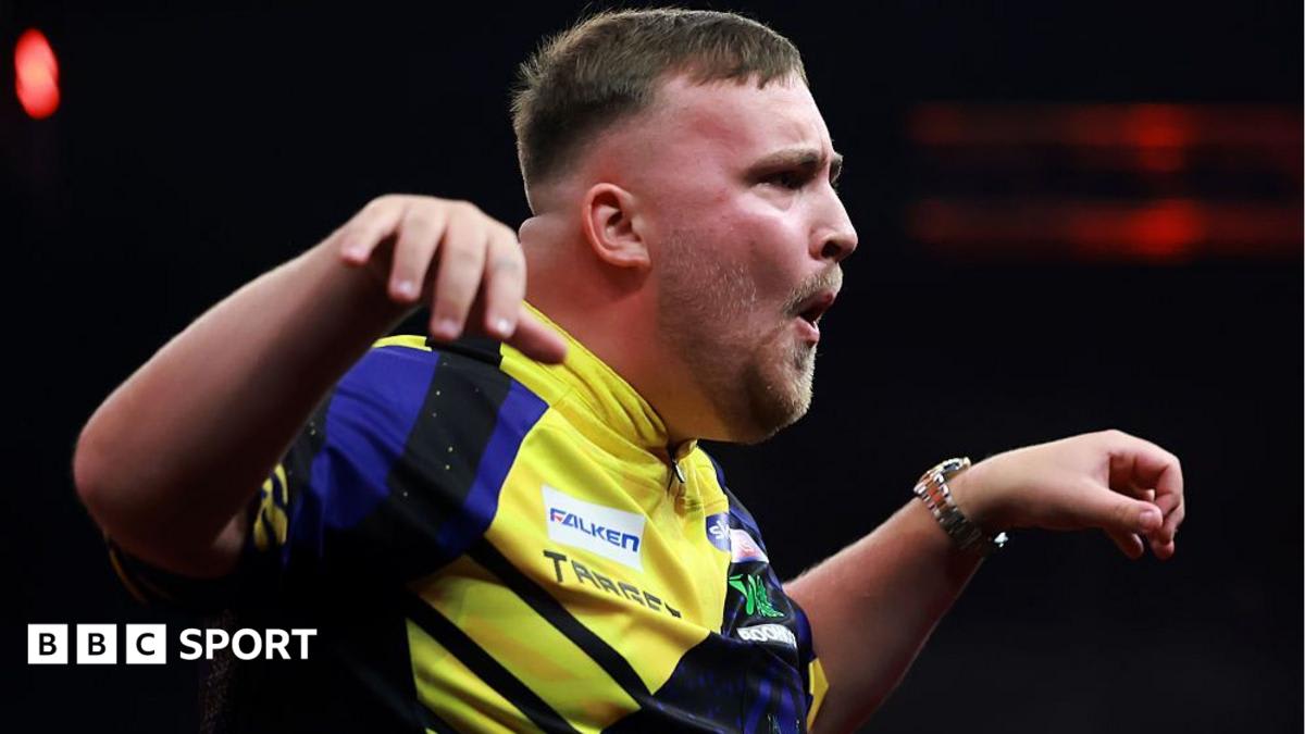 Young darts champion Luke Littler celebrates passionately during World Series Finals match in Amsterdam