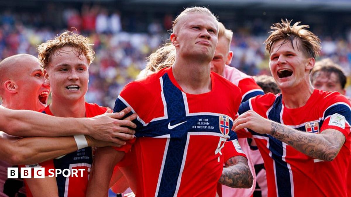 Norwegian national football team players celebrating together on the field during World Cup match