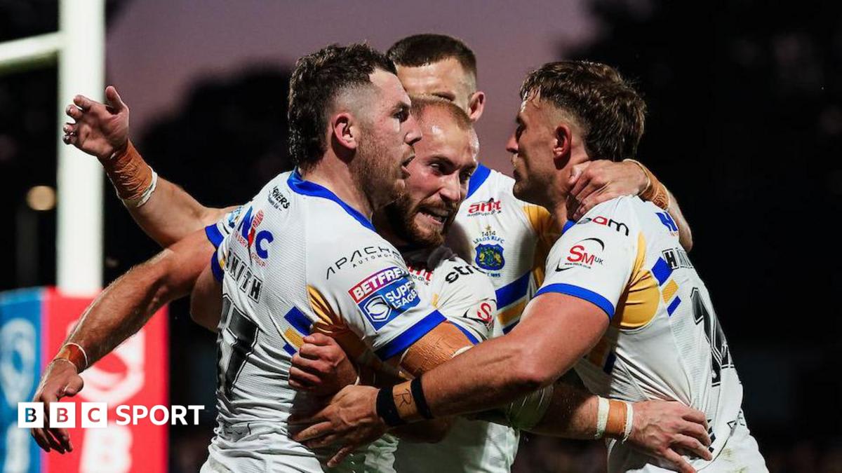 Leeds Rhinos rugby players celebrating together on field after dramatic comeback victory