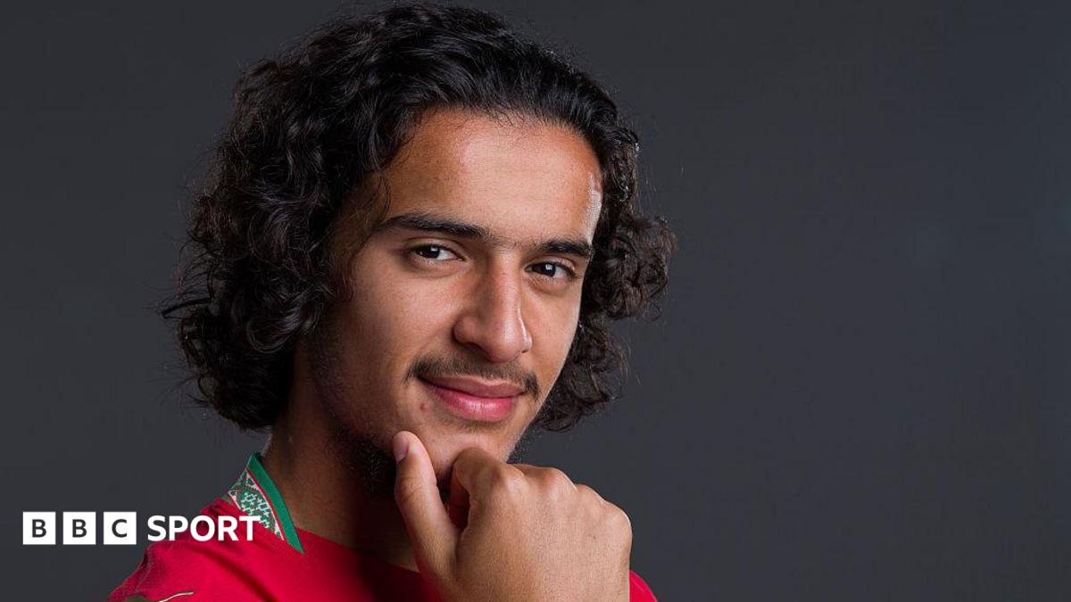 Ayyoub Bouaddi in Morocco's red jersey controlling the ball during World Cup match