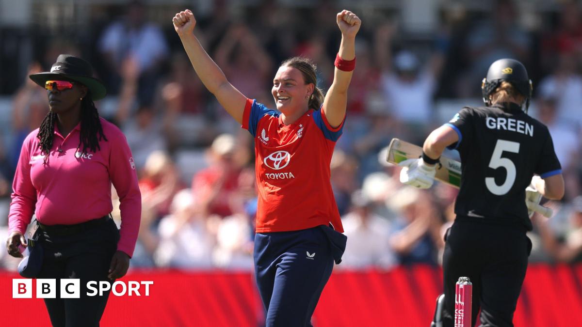 Dani Gibson celebrates taking a wicket for England against New Zealand in sunny conditions at Hove