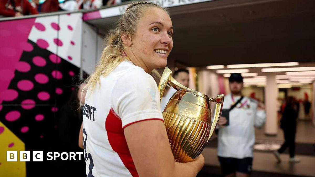 England rugby captain Zoe Stratford in red jersey celebrating on the pitch