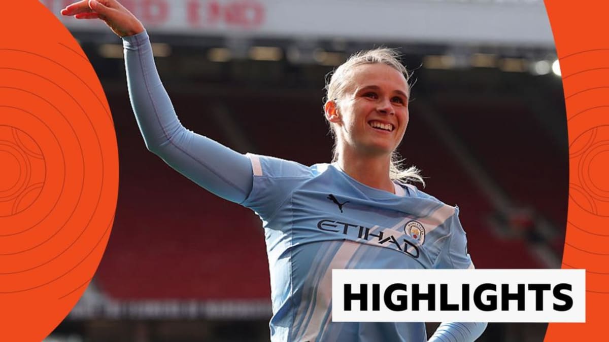 Vivianne Miedema celebrating in Manchester City blue jersey during WSL derby match