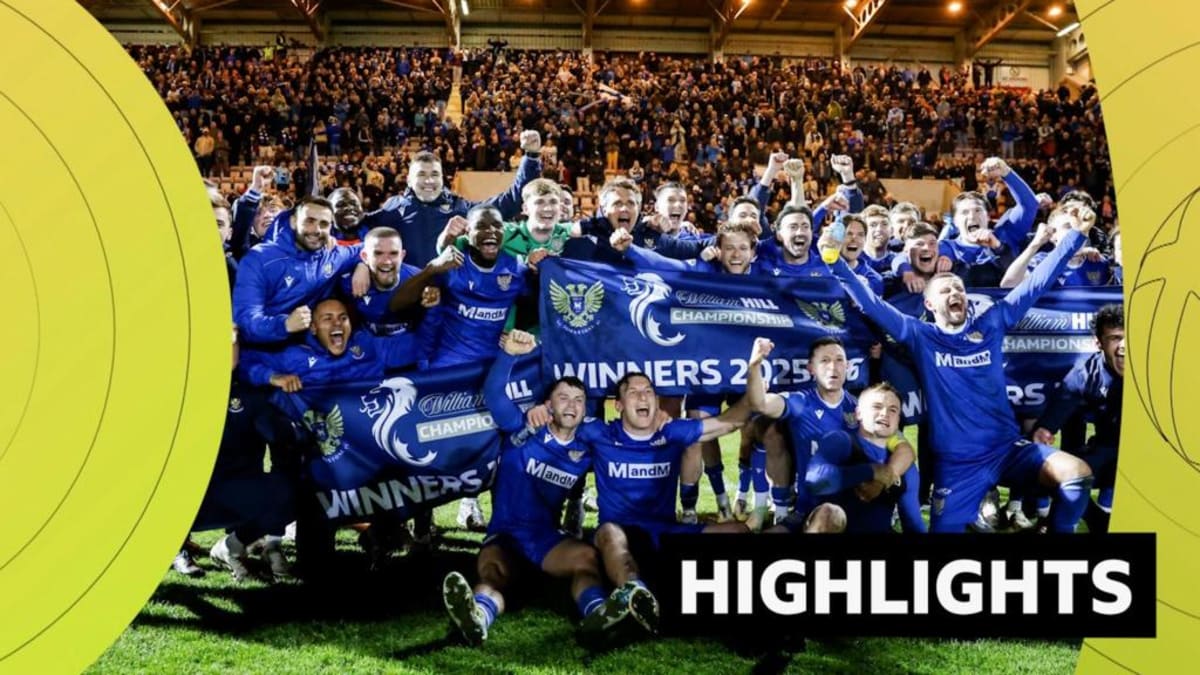 St Johnstone football players celebrating championship title win on the pitch together