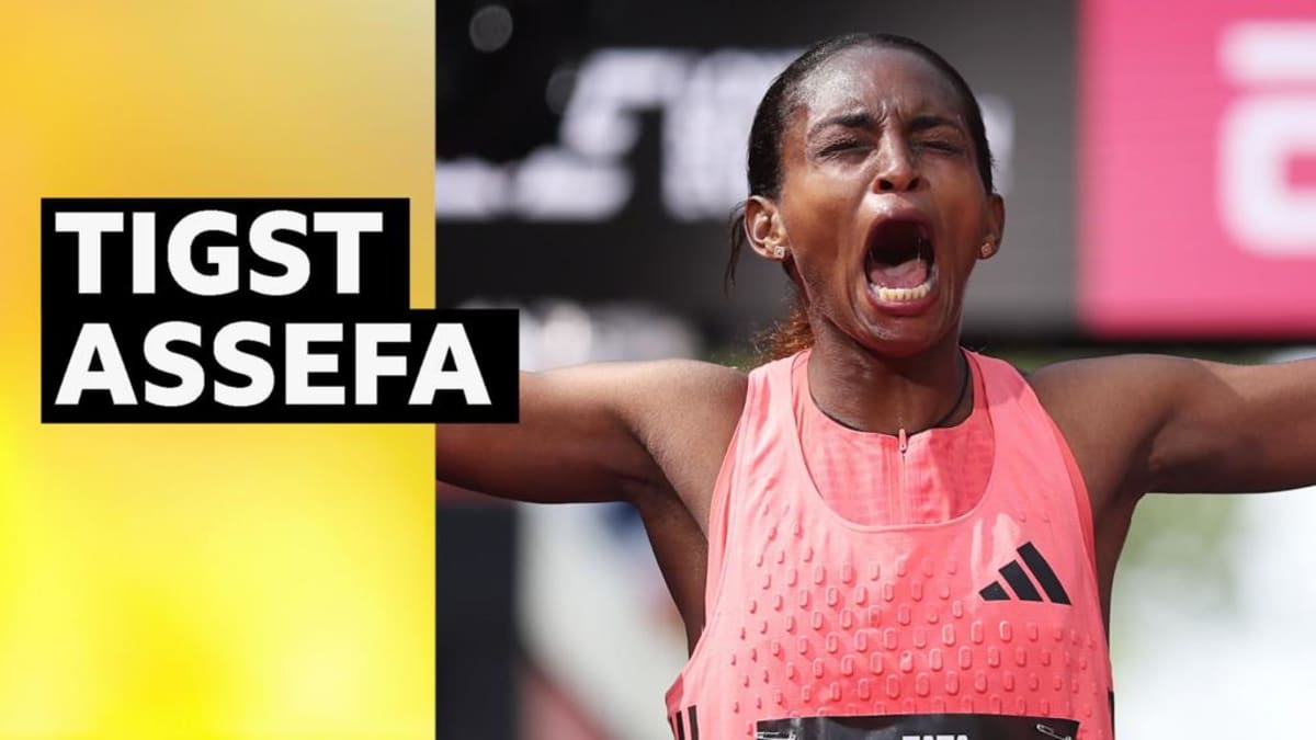 Ethiopian runner Tigst Assefa crossing finish line at London Marathon in record time