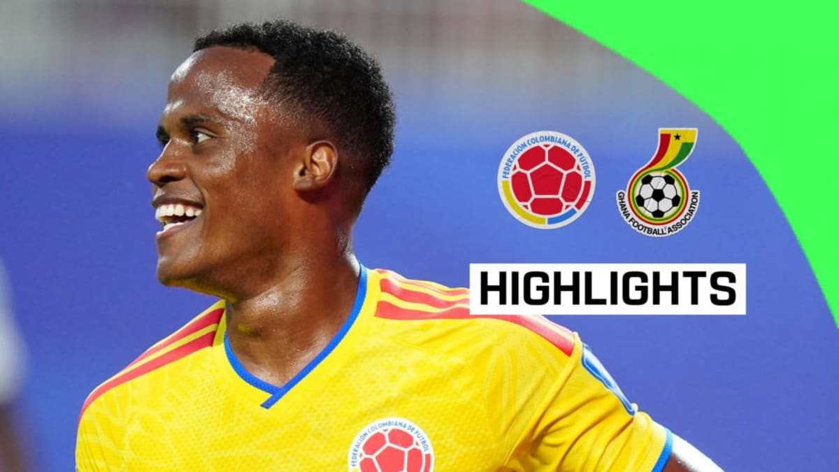Colombian soccer players celebrating on field after qualifying for World Cup knockout rounds