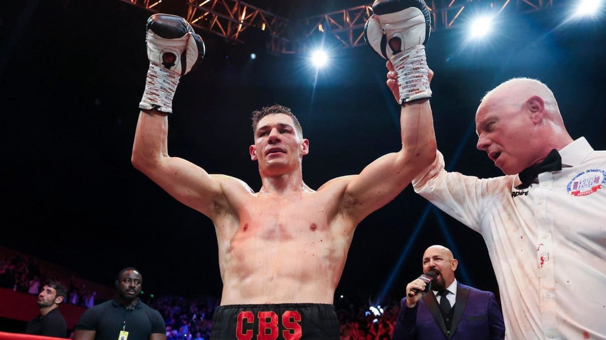 Chris Billam-Smith celebrates victory on the ropes at Bournemouth International Centre boxing match