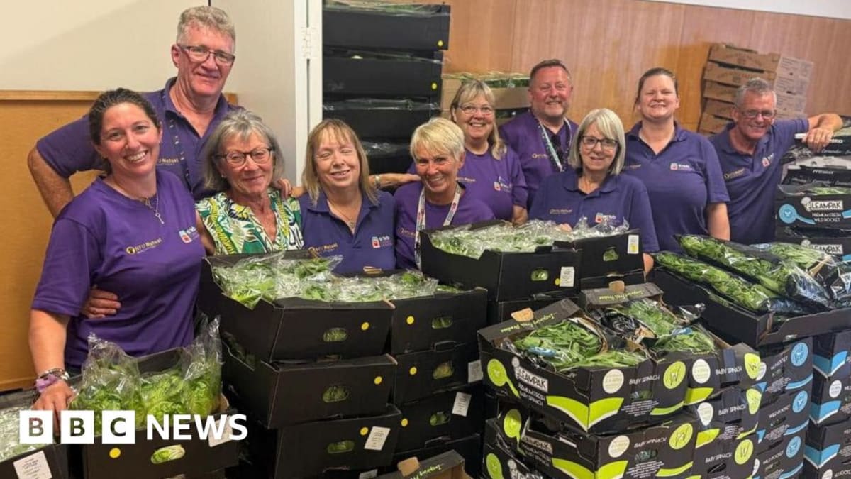 Volunteers sorting through fresh produce and packaged foods rescued from Silverstone racing circuit
