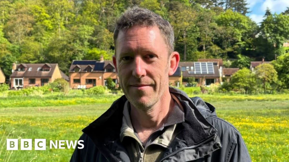 Stuart Edmunds displays a wooden monitoring box prototype designed to track endangered water voles in Shropshire