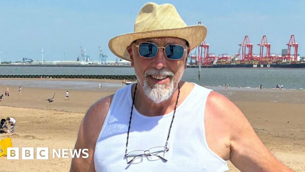 Volunteers collecting scattered trash and abandoned belongings from sandy New Brighton beach after holiday crowds