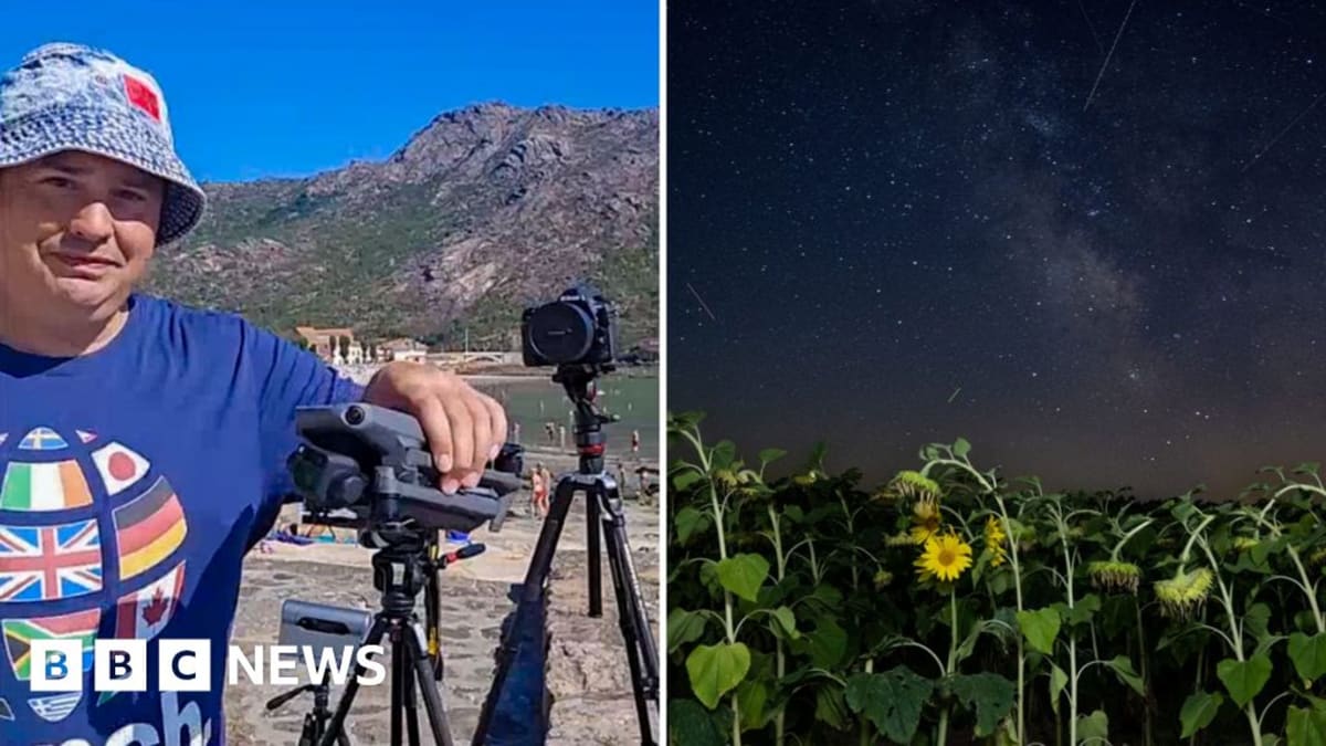 Photographer with camera equipment positioned on Spanish hillside awaiting total solar eclipse